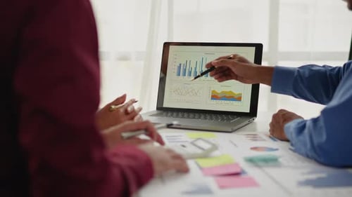 Close up of business hands are working and brainstorming on paperworks.