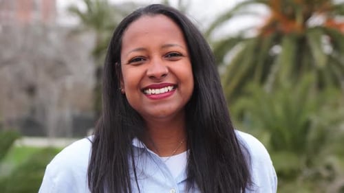 Smiling Woman Portrait in Urban Park Setting