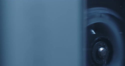 Extreme Close-Up Of Microcassette Recorder Reel Turning, Framed Far Right