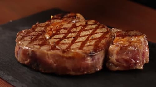 Chef cooks meat on the grill