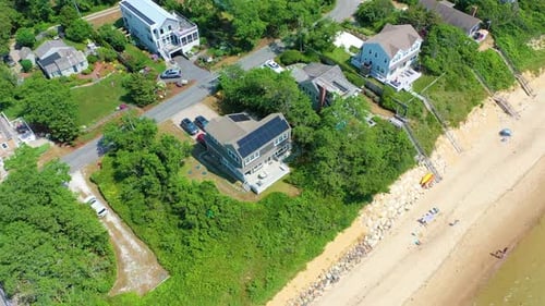 Aerial View of Beach House with Green Surrounds