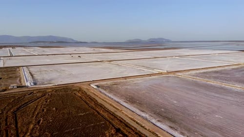 View of a Salt Flat Factory Besides the Sea Drone Shot of Salt Extraction