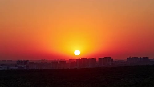 Scenic Sunset Over a Bustling Cityscape