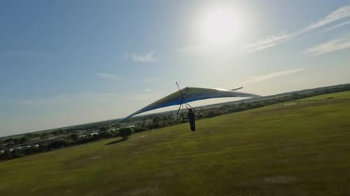 Aerial view of hang glider towed by a plane