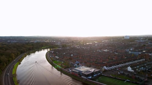 Aerial shot of the River Lagan, Belfast on an autumm day. The camera begins high in the sky, moving