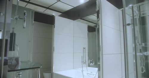 Elegant bathroom inside a luxury hotel in Spain. Ceramic and mirrors of quality material. 4K