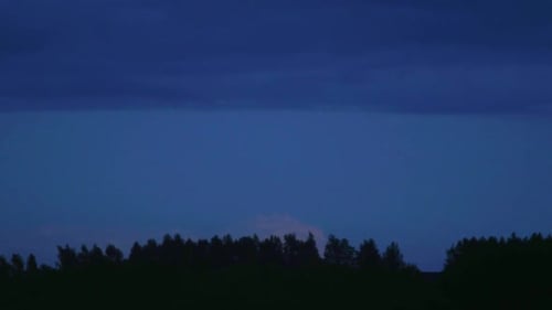 Evening clouds moving over forest timelapse