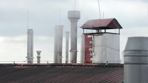 Industrial Chimneys on Commercial Building in Daytime
