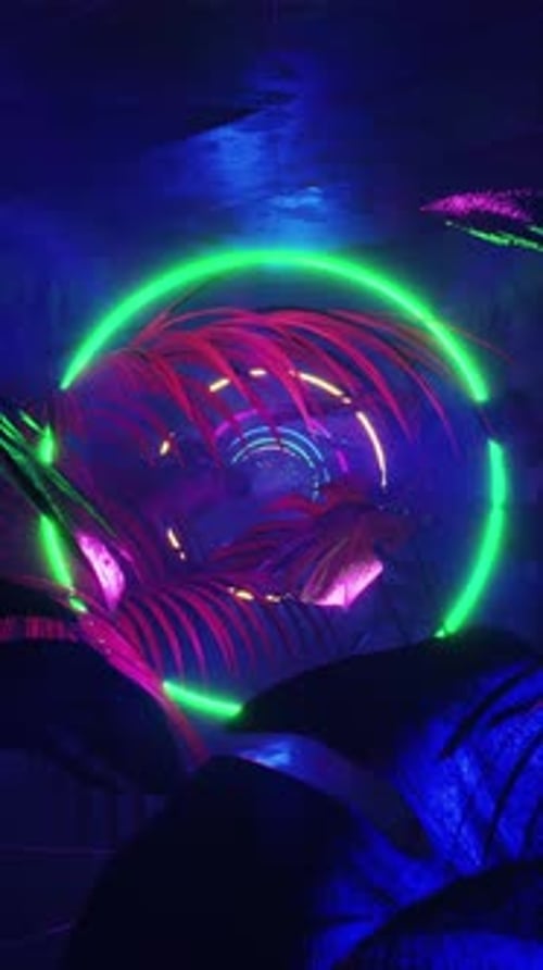 Vertical Neon Rings and Tropical Leaves Loop Background