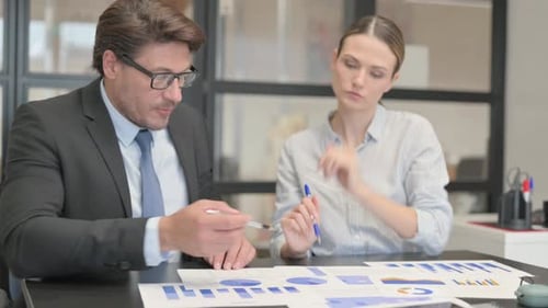 Business People Doing Paperwork in Office