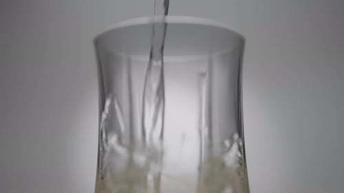 Transparent Liquid Poured Into a Glass