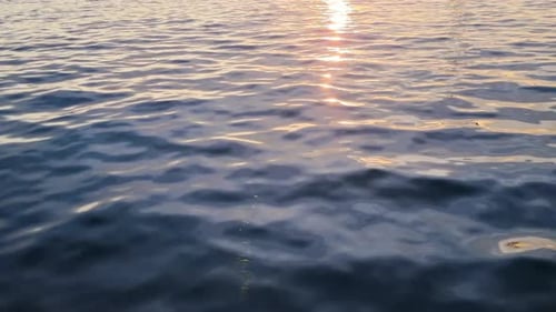 Slow Motion Sea Surface at Sunset