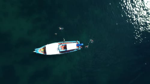 Aerial view of people snorkelling in shark bay on Ko Tao island, Thailand.