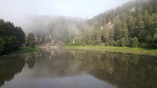 Aerial Footage of a Beautiful Landscape with a River Flowing Through Forests and Wetlands Morning