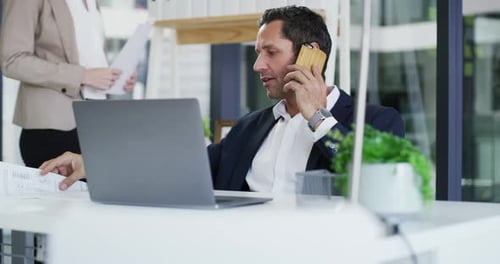 Business man, phone call and paperwork for discussion, networking and connection in office