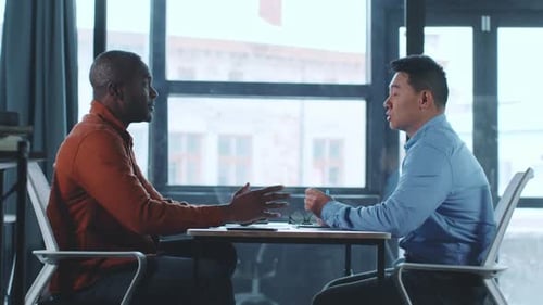 Business Meeting Between Two Professionals in a Modern Office Setting