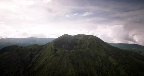 Crater of Mount Batur or Gunung Batur, active volcano on Bali island, Indonesia. Aerial forward risi