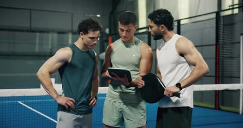 Men, fitness or schedule with tablet in padel court for game preparation or online match setup