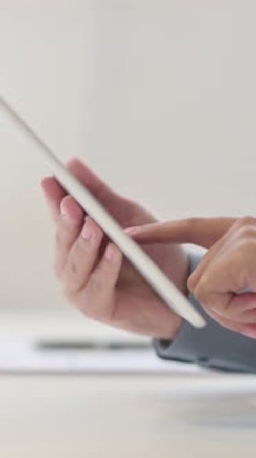 Hands Vertical Close up of African Woman working on Tablet