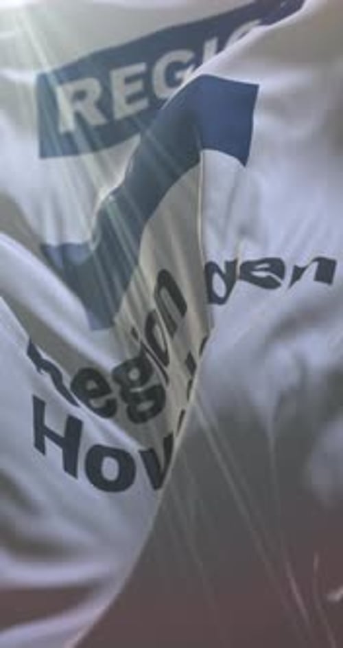 Waving Flag Background with Region Five Text and Light Rays