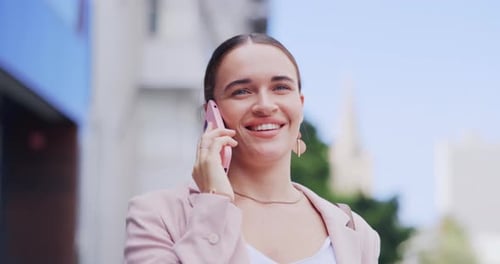 Happy Woman Talking on Phone in City