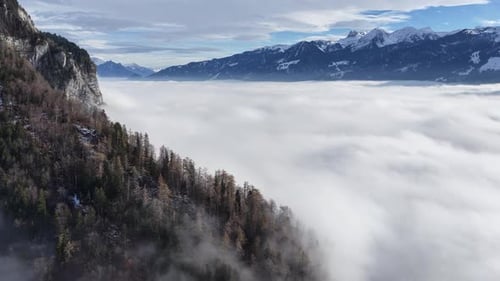Breathtaking Alpine Peaks Rising Above a Thick Sea of Clouds