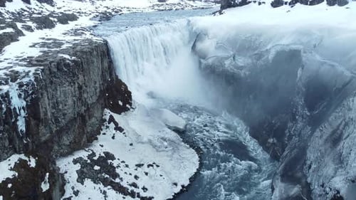 Dettifoss Waterfall in Iceland Frozen Winter Landscape with Snow and Ice Aerial View