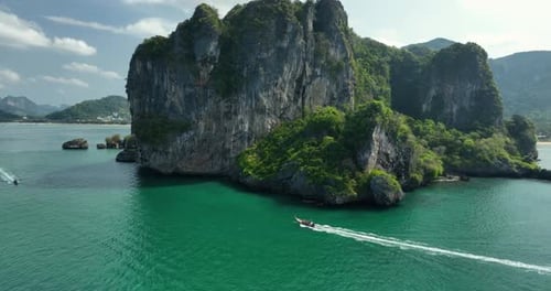 Aerial view limestone cliffs and turquoise sea, Thailand