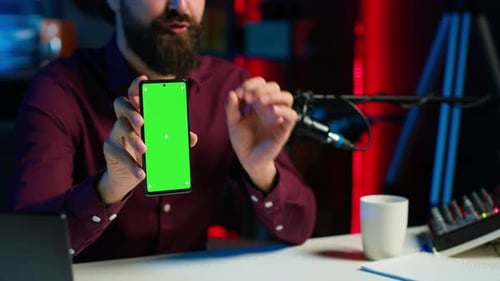 Content Creator Reviewing Mockup Phone Received From Sponsor Close Up