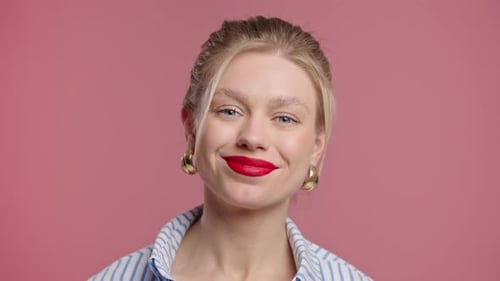 Smiling Woman with Blonde Hair Posing in Studio