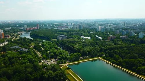 Top View of City with Dam and River on Sunny Summer Day Creative Beautiful Green City with Dam and