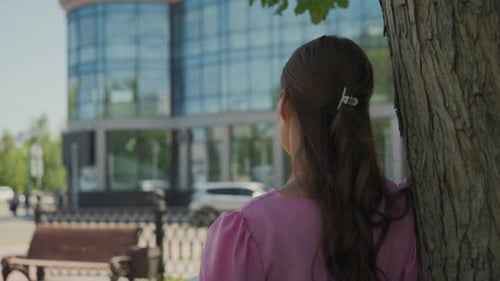 Woman Stands by Tree, Sketches in Notebook