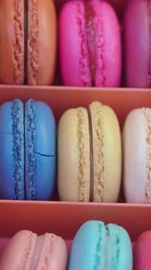 Colorful Macarons Arranged in a Neat Display at a Cafe