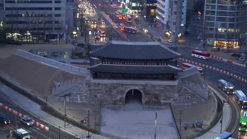 Vehicles And City Bus Driving On The Road Near Sungnyemun Gate At Night In Seoul, South Korea. - hig