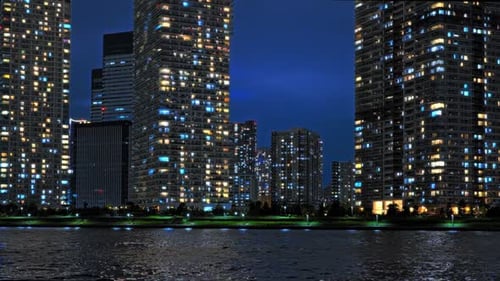 Modern City Skyline and Tower Reflections at Night