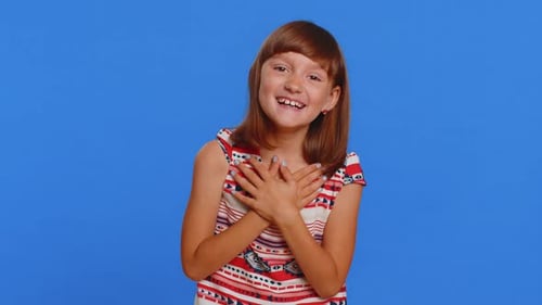 Happy Smiling Girl Posing Against Blue Background