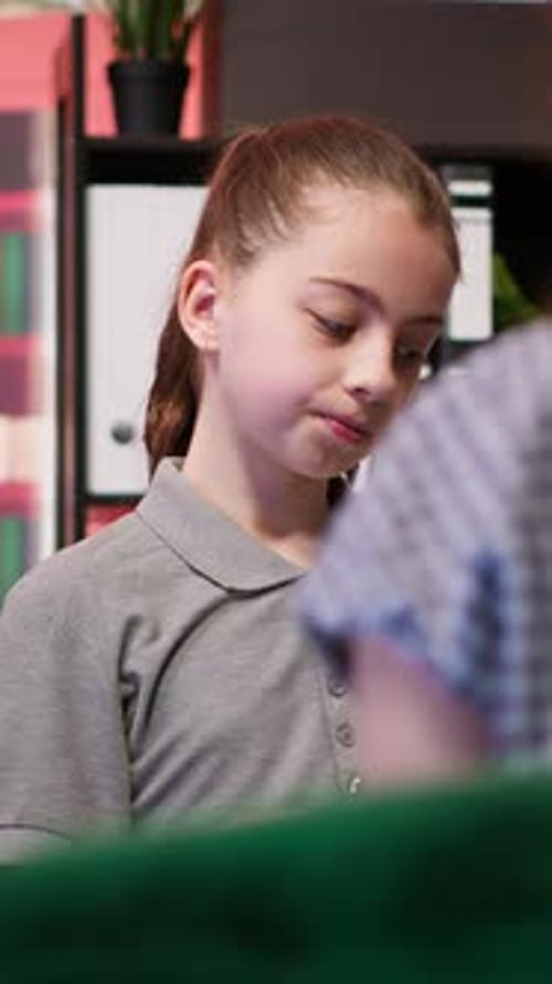 Student Presents Lesson to Classmate in School