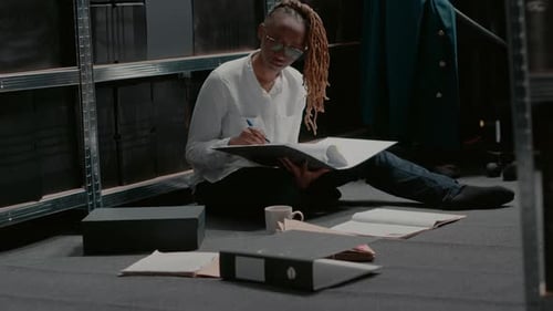 Young Woman Working in Storage Records Room
