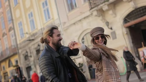 Carefree Couple Dancing and Having Fun on City Street