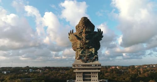 Drone Aerial view 4k Statue of Vishnu in Garuda Wisnu Kencana at sunrise, bali, indonesia