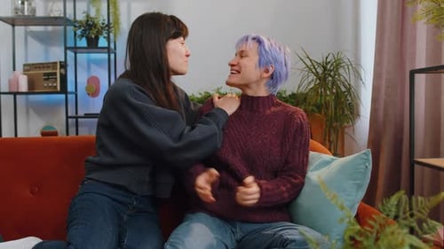 Intimate Couple Embracing on Sofa in Cozy Home