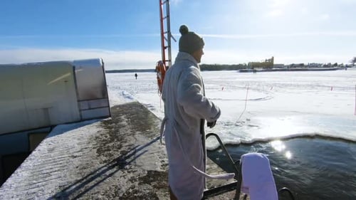 Man Ice Swimming in Frigid Winter Water