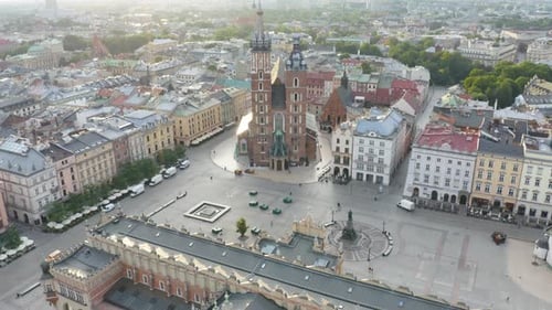 Cinematic Establishing Shot of St. Mary's Basilica in Krakow's Old Town. Sunrise