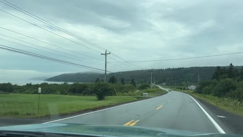 Rain Drops On Car Windshield While Driving Through Nova Scotia Canada