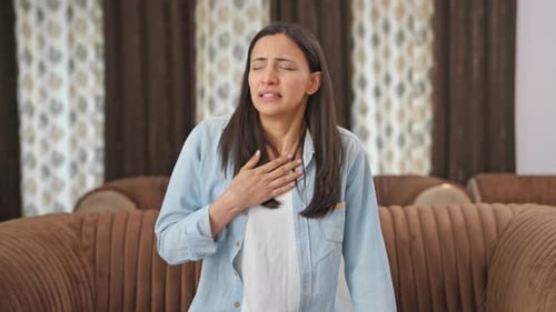Indian woman feeling breathlessness and having Asthma attack