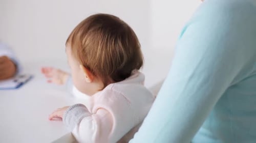 Baby Exam Visit with Doctor and Mother