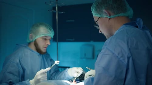 Surgeons Performing Surgical Procedure in Operating Room