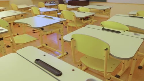 Empty Classroom with Desks and Chairs