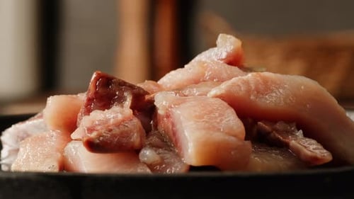Pieces of Herring Fish are Lying on a Plate Closeup Macro Herring Fillet in Oil and Spices Marinated