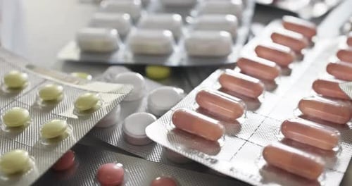 Assorted Medication Pills and Capsules in Blister Packs